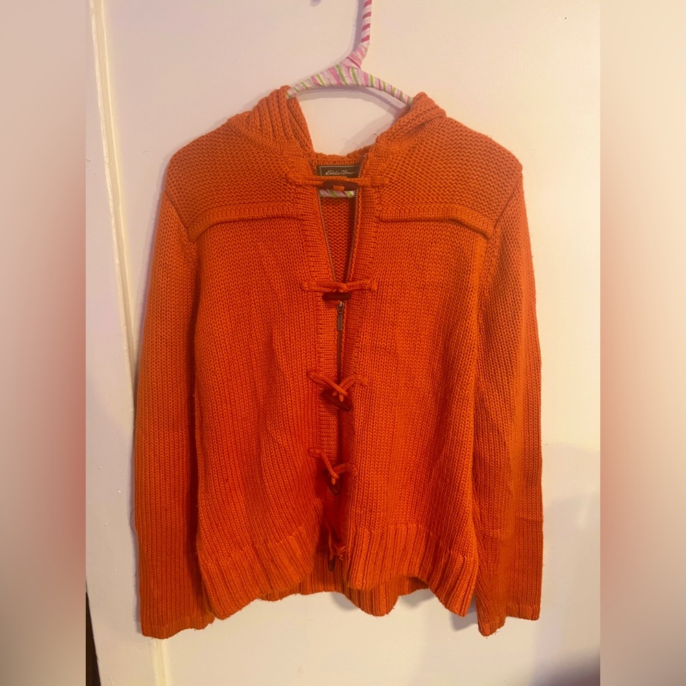 Eddie Bauer orange knit zip up cardigan with a hood, and tooth buttons.